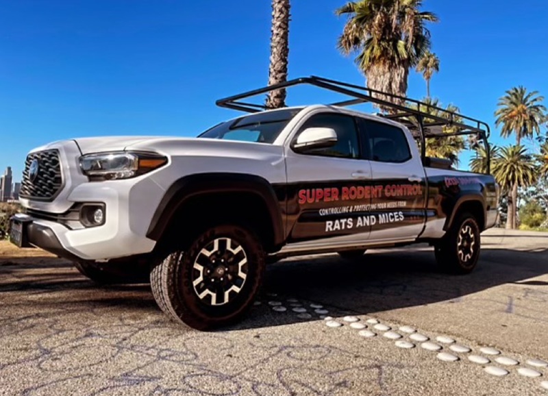 Super Rodent Control technician with a service truck